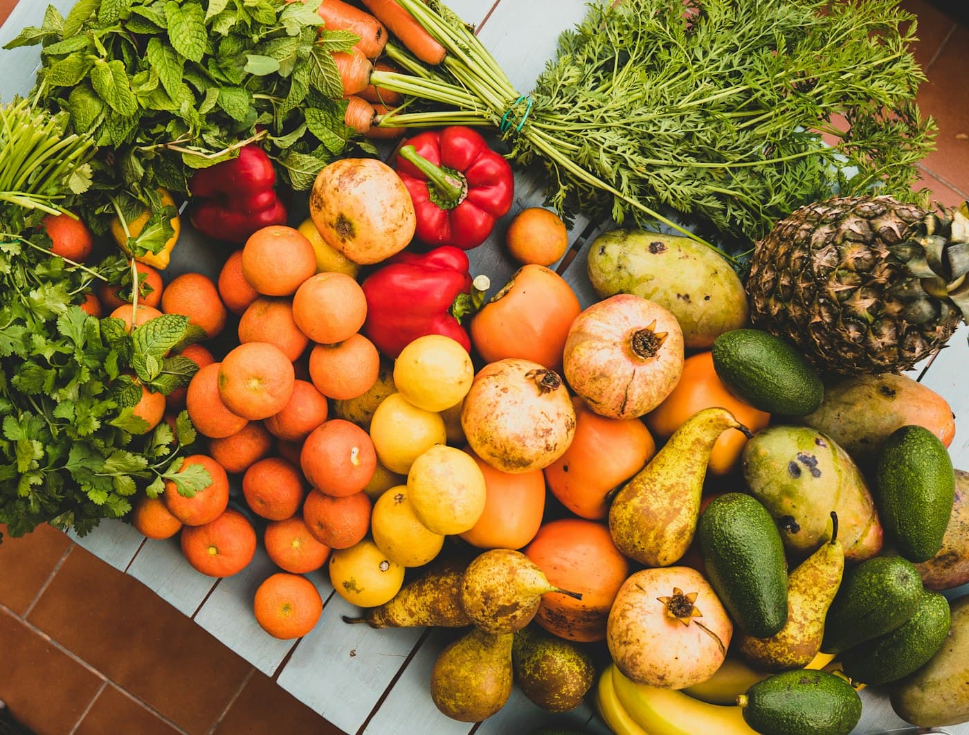 Crate of fresh seasonal fruits and vegetables, freshly harvested from local producers